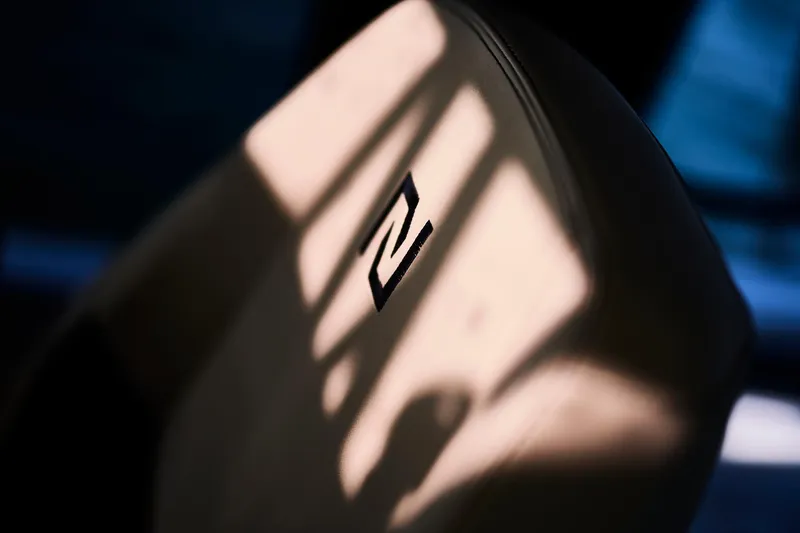 Slide: The Image of Close-up of Northman 1050 seat with logo, 2025 model, in soft lighting. - 26