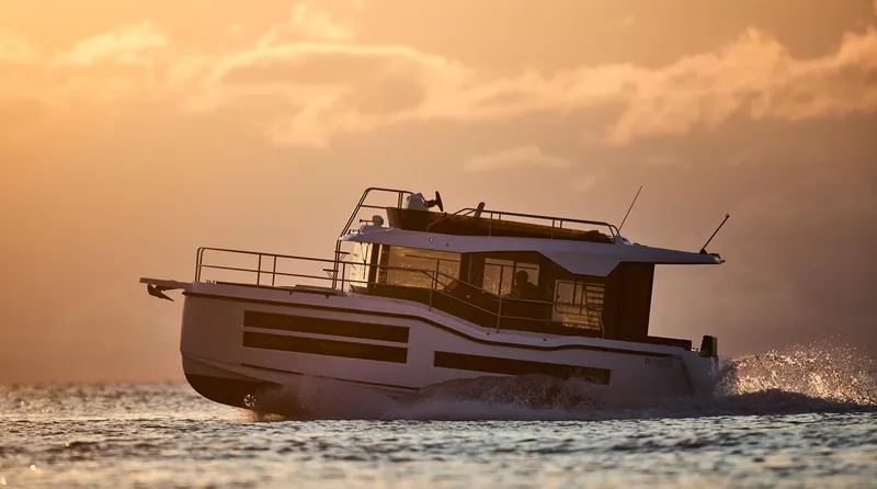 Slide: The Image of Modern Northman 1050 boat cruising at sunset, 2025 model. - 8