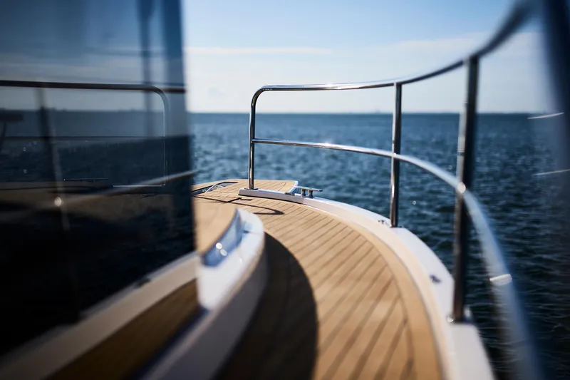 Slide: The Image of Sleek Northman 1050 yacht deck overlooking serene ocean, 2025 model. - 16