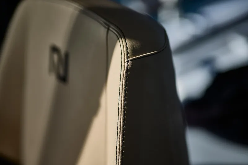 Slide: The Image of Close-up of Northman 1050 seat stitching, 2025 model, in soft lighting. - 27