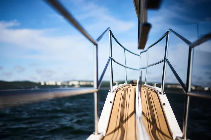 Slide: The Image of Deck view of Northman 1050 yacht, 2025 model, reflecting on calm waters. - 29