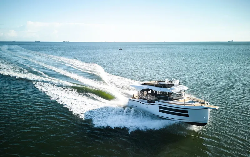 Slide: The Image of 2025 Northman 1050 yacht cruising on open sea, leaving a wake behind. - 33