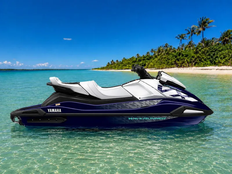 The Image of A 2026 Yamaha WaveRunner VX Cruiser® HO floats in clear turquoise water near a tropical island. - 0