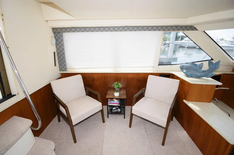 Slide: The Image of Interior of 2000 Carver 356 Aft Cabin Yacht with two chairs. - 11