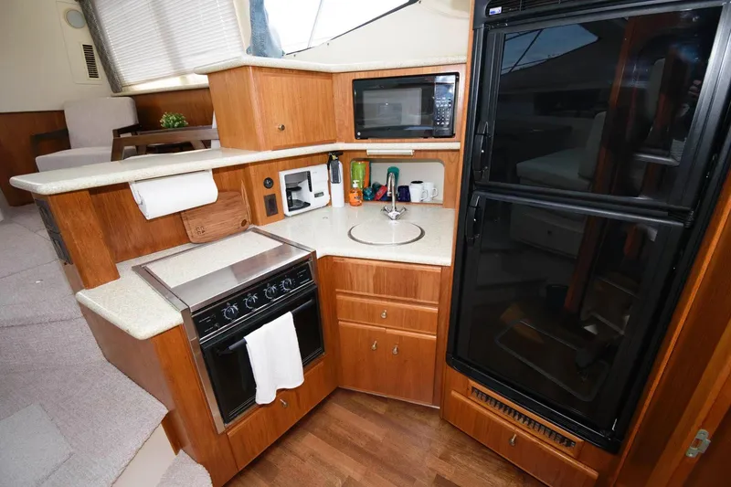 Slide: The Image of Interior of 2000 Carver 356 Aft Cabin Motor Yacht with cozy dining area. - 15
