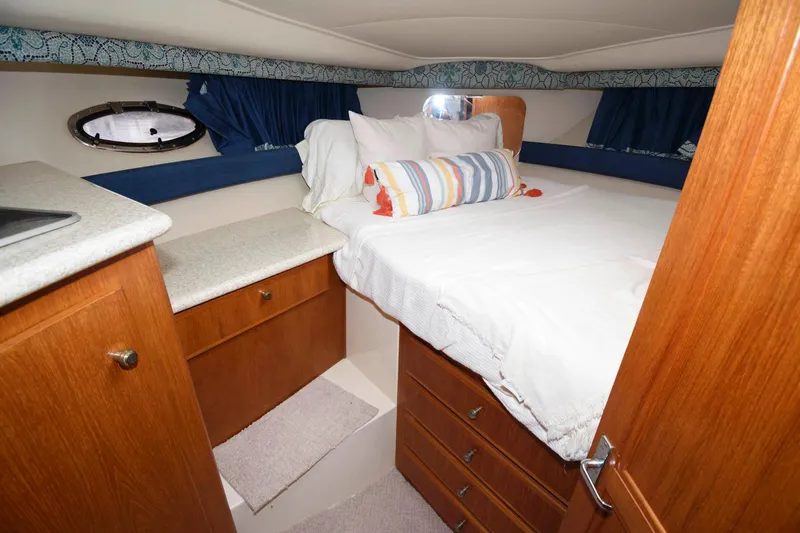 Slide: The Image of Cozy cabin interior of 2000 Carver 356 Aft Cabin Motor Yacht with bed and storage. - 19