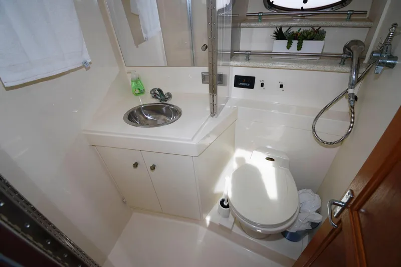 Slide: The Image of 2000 Carver 356 yacht bathroom with sink and toilet. - 20