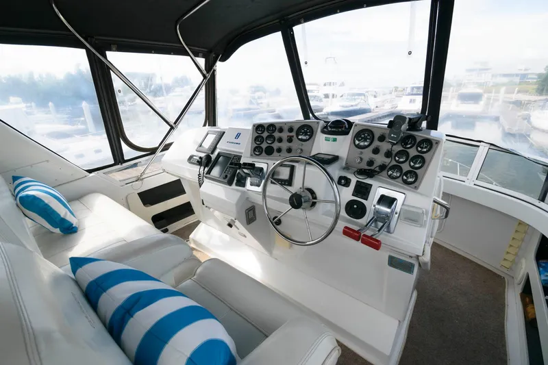 Slide: The Image of Aft cabin of 2000 Carver 356 Motor Yacht with wooden chairs and table. - 6