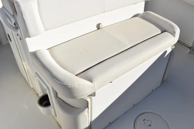Slide: The Image of 2020 Sea Hunt Ultra 255 SE boat interior seating with cup holder. - 17