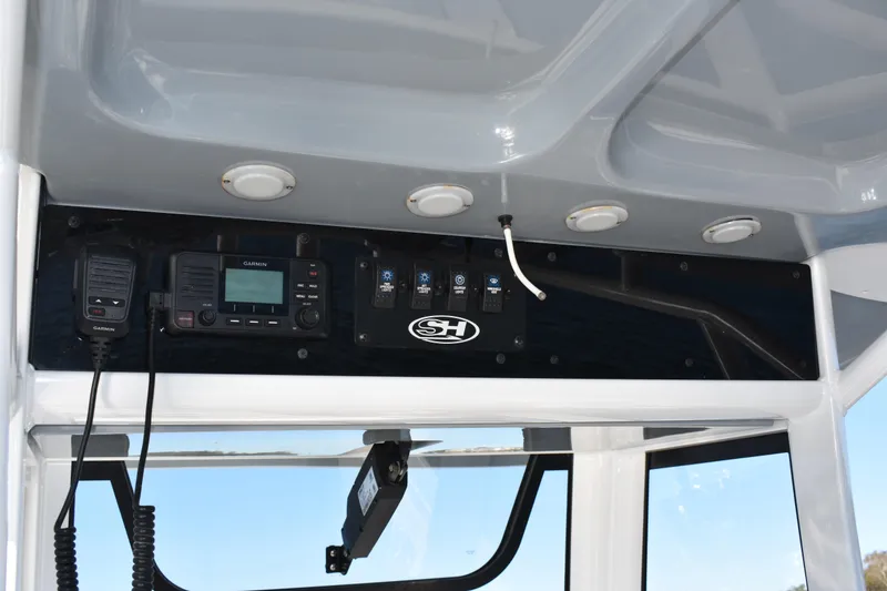Slide: The Image of 2020 Sea Hunt Ultra 255 SE dashboard with Garmin electronics and control panel. - 22