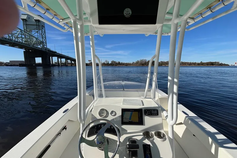 Slide: The Image of Interior view of a 2021 Savannah SS21 boat on a river near a bridge. - 7