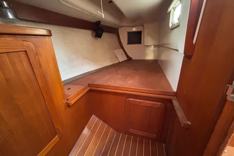 Slide: The Image of Interior cabin of a 1997 Caliber 40LRC sailboat with wooden finishes. - 17