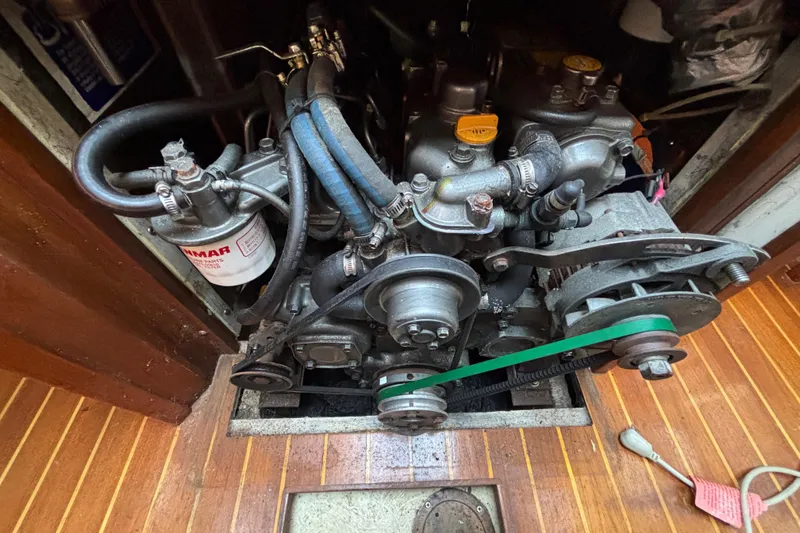 Slide: The Image of Engine of a 1997 Caliber 40LRC sailboat, featuring Yanmar components and belts. - 30