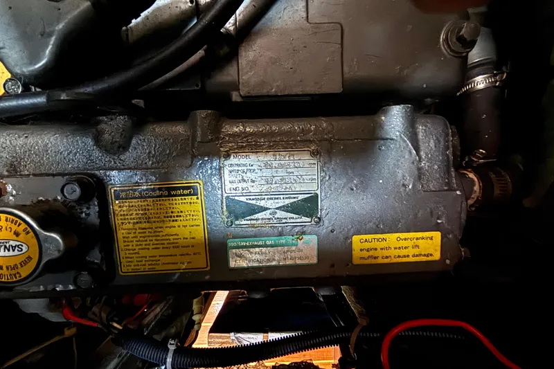 Slide: The Image of Engine compartment of a 1997 Caliber 40LRC with caution labels and specifications. - 31