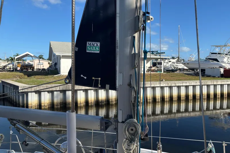 Slide: The Image of Sailboat docked with Mack Sails, Caliber 40LRC, 1997 model, in a marina setting. - 4