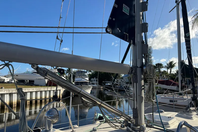 Slide: The Image of Sailboat deck view with rigging, Caliber 40LRC, 1997, docked in a marina under blue sky. - 5
