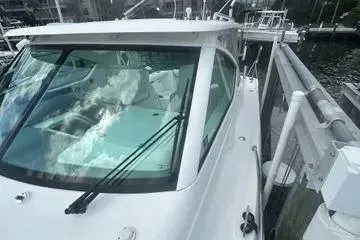 Slide: The Image of 2007 Tiara Yachts 3000 Open interior with kitchenette and seating area. - 13