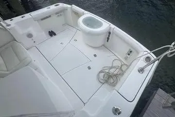 Slide: The Image of 2007 Tiara Yachts 3000 Open interior with white seating and helm station. - 7