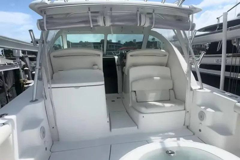 Slide: The Image of 2007 Tiara Yachts 3000 Open interior with white seating and cabinetry. - 8