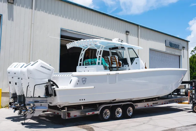 The Image of 2026 Barker Boatworks 40HPC cruising on open water at sunset. - 0