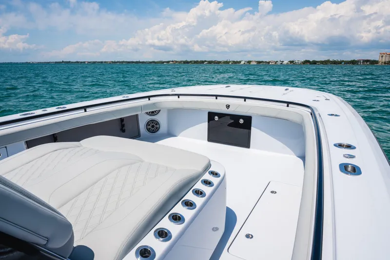 Slide: The Image of 2026 Barker Boatworks 40HPC on open water, showcasing luxurious seating and sleek design. - 11