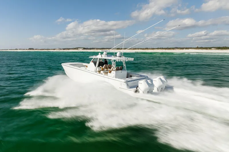 Slide: The Image of 2026 Barker Boatworks 40HPC speeding on open water, showcasing powerful performance. - 22