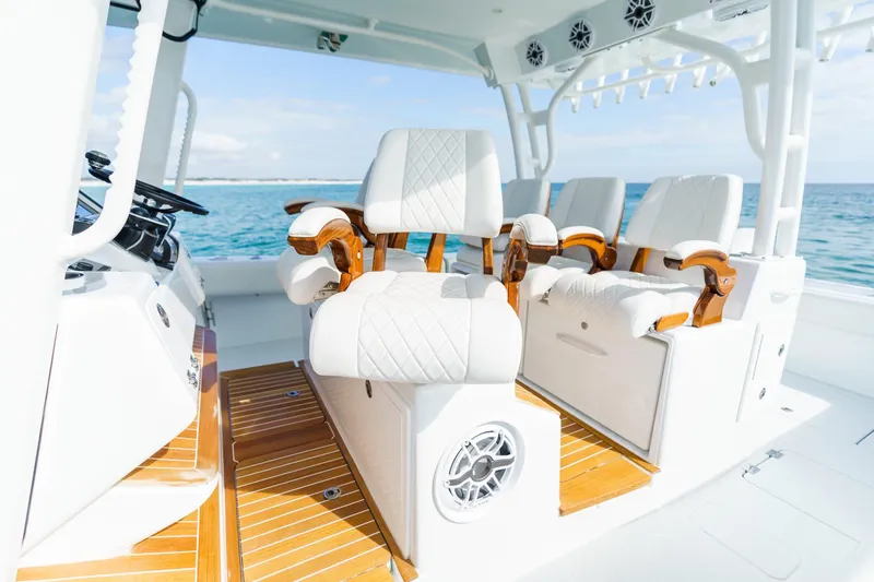 Slide: The Image of Luxury seating on 2026 Barker Boatworks 40HPC, featuring elegant white and wood accents. - 23