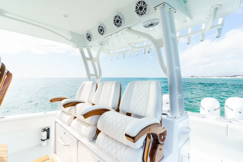 Slide: The Image of Luxurious seating on 2026 Barker Boatworks 40HPC, overlooking serene ocean waters. - 26