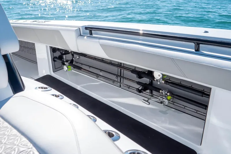 Slide: The Image of 2026 Barker Boatworks 40HPC fishing rod storage on a sleek boat deck. - 3