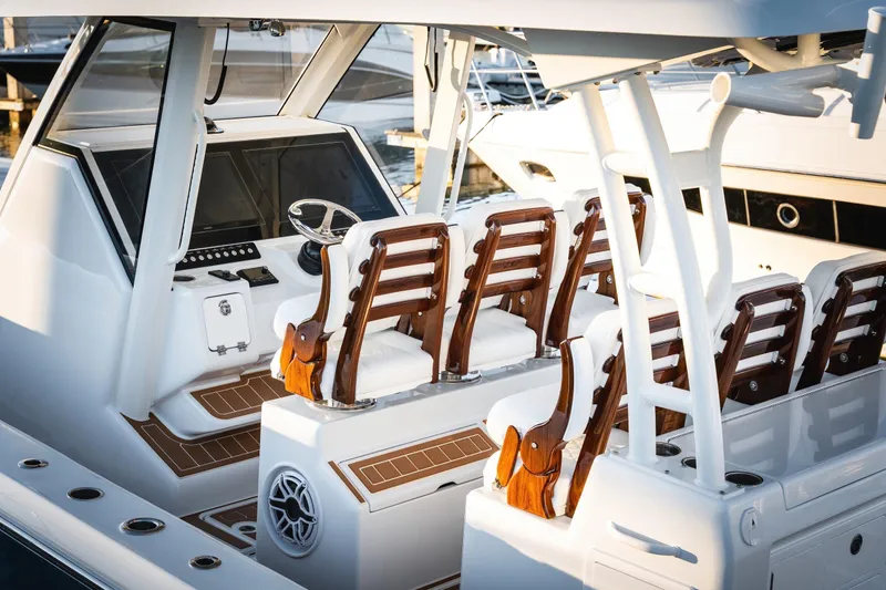 Slide: The Image of 2026 Barker Boatworks 40HPC with luxurious seating and modern helm design. - 37