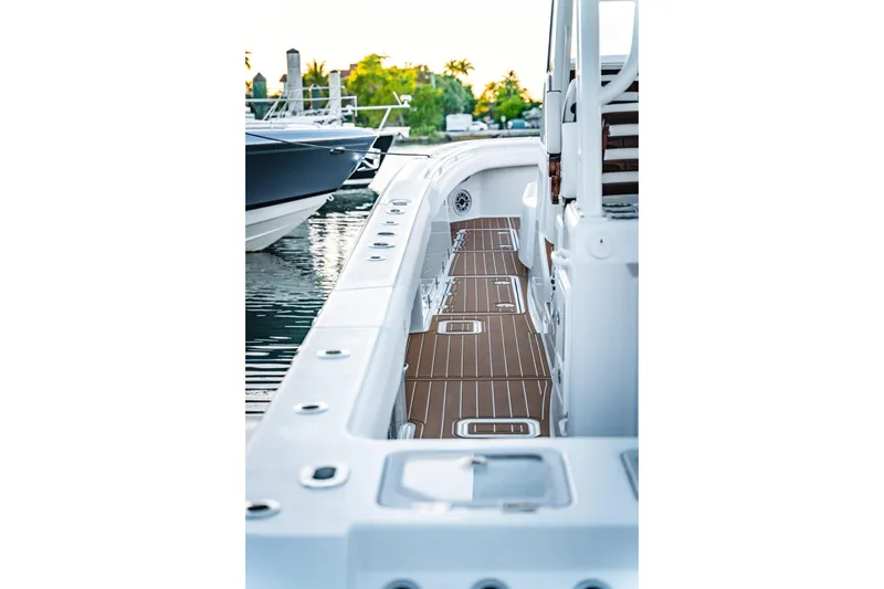 Slide: The Image of 2026 Barker Boatworks 40HPC, sleek deck view at marina, showcasing modern design. - 39