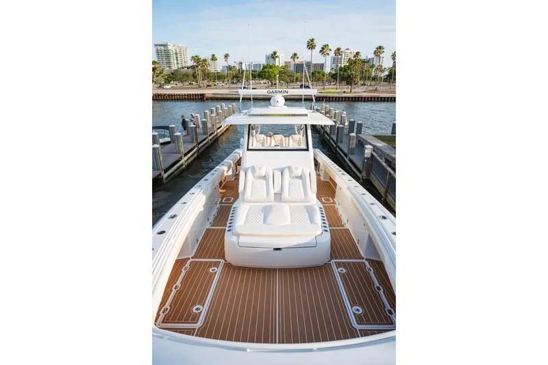 Slide: The Image of 2026 Barker Boatworks 40HPC with sleek deck design, docked by waterfront. - 46