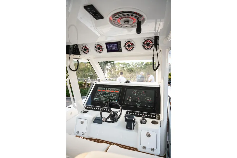 Slide: The Image of 2026 Barker Boatworks 40HPC helm with advanced navigation and control systems. - 48