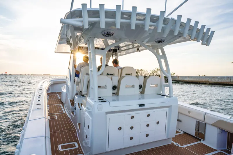 Slide: The Image of 2026 Barker Boatworks 40HPC cruising at sunset, featuring spacious deck and modern design. - 52