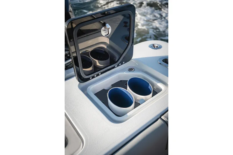 Slide: The Image of Cup holders on 2026 Barker Boatworks 40HPC, featuring a sleek design and open compartment. - 57