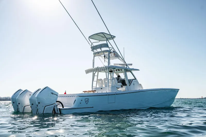 Slide: The Image of 2026 Barker Boatworks 40HPC on water, featuring triple outboard engines. - 34