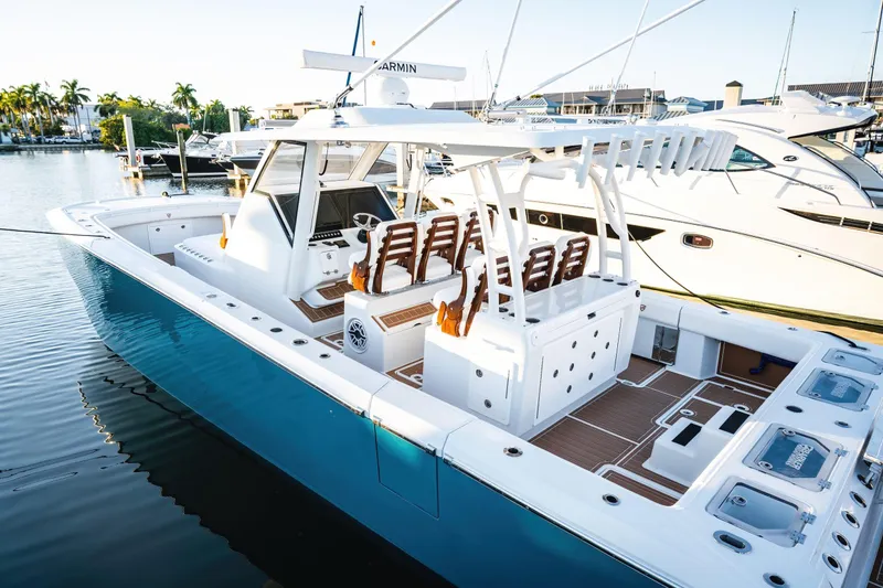 Slide: The Image of 2026 Barker Boatworks 40HPC in marina, showcasing sleek design and spacious deck. - 36