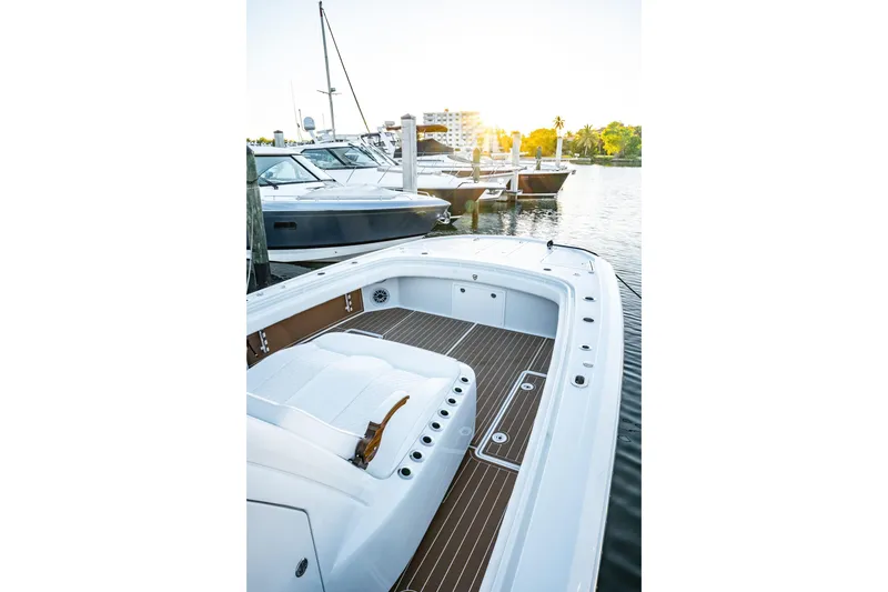 Slide: The Image of 2026 Barker Boatworks 40HPC docked at marina during sunset. - 38
