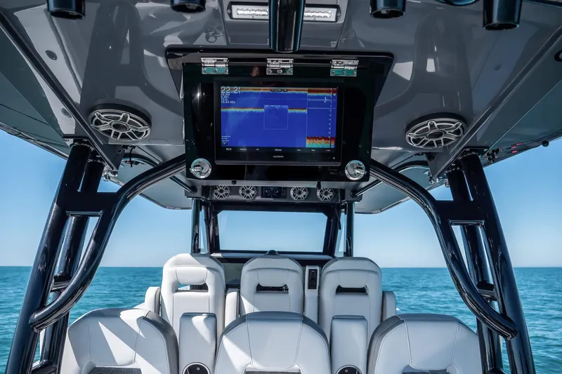 Slide: The Image of 2026 Barker Boatworks 40HPC interior with advanced navigation system and luxurious seating. - 4