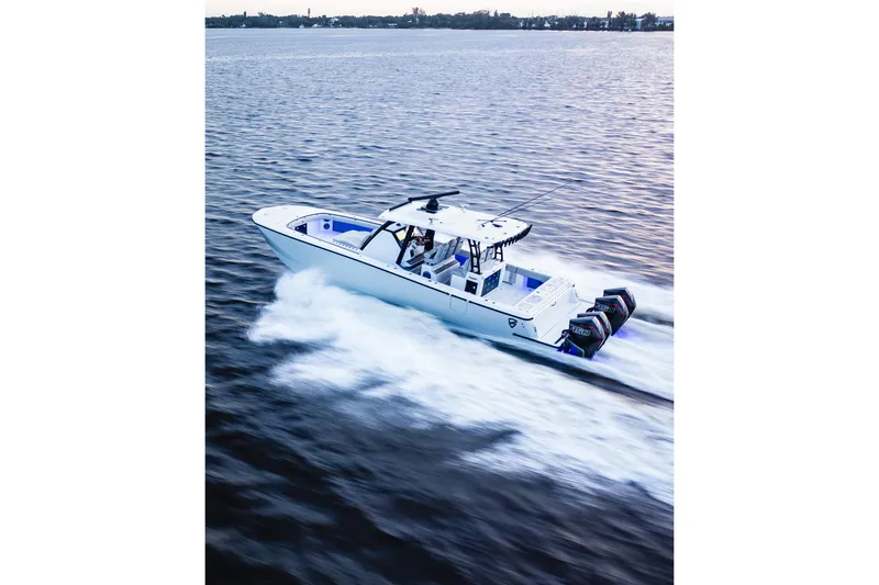 Slide: The Image of 2026 Barker Boatworks 40HPC speeding on water, showcasing powerful engines and sleek design. - 5