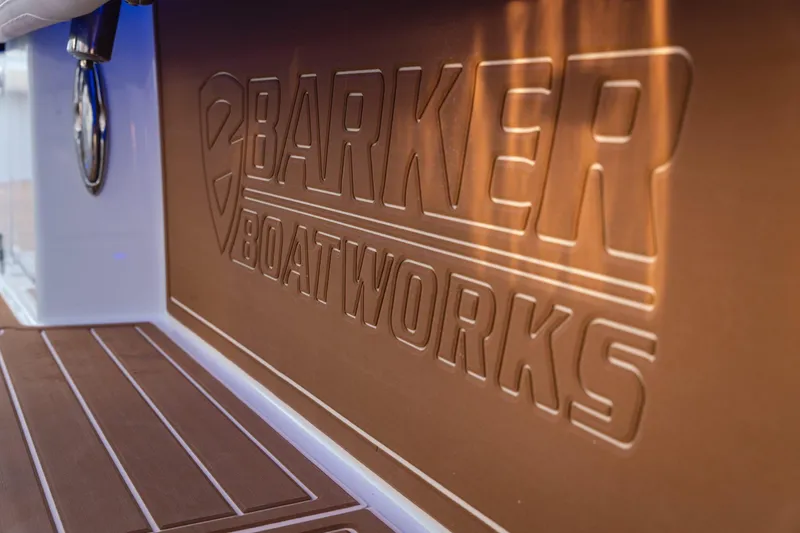 Slide: The Image of Barker Boatworks 40HPC 2026 logo embossed on boat interior panel. - 50