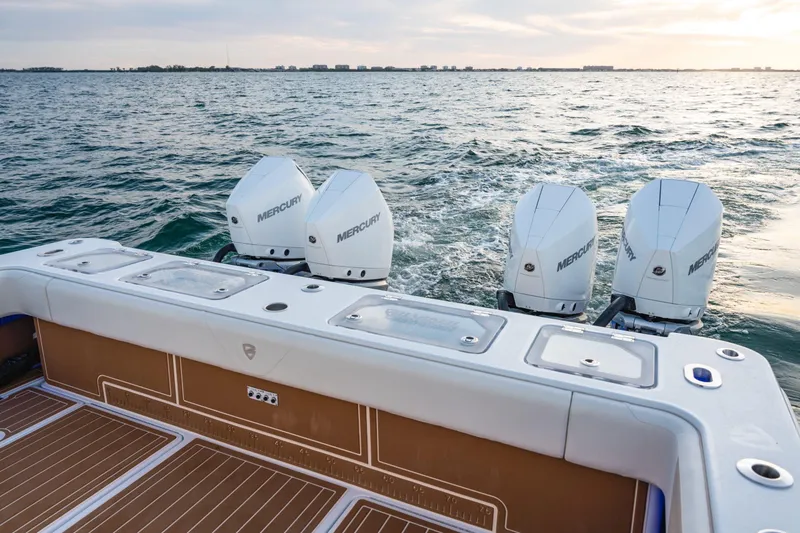 Slide: The Image of 2026 Barker Boatworks 40HPC with four Mercury engines on open water. - 54