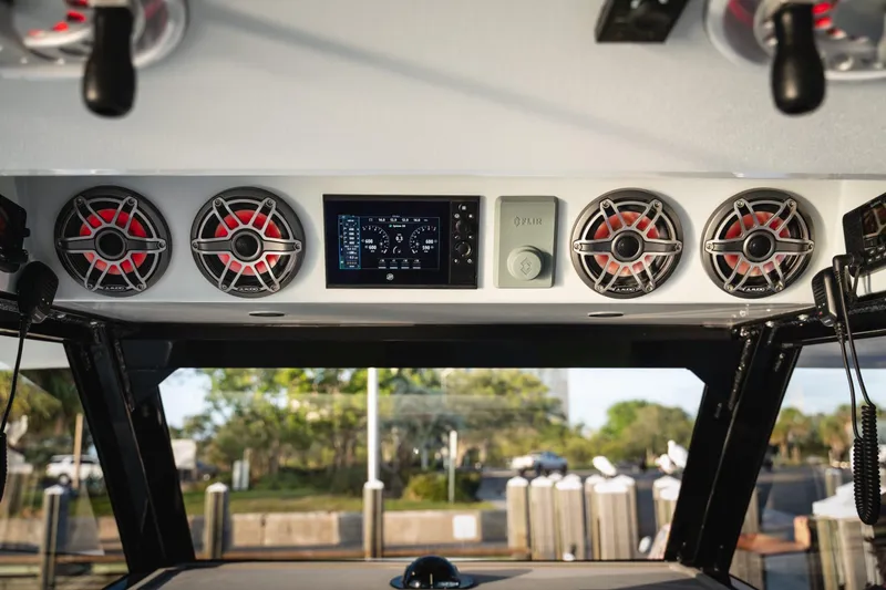 Slide: The Image of 2026 Barker Boatworks 40HPC dashboard with speakers and control panel. - 56