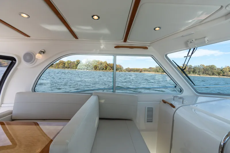 Slide: The Image of Interior of 2023 Back Cove 340 yacht with scenic water view through windows. - 14