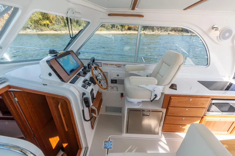 Slide: The Image of Luxurious interior of 2023 Back Cove 340 boat with helm station and comfortable seating. - 27