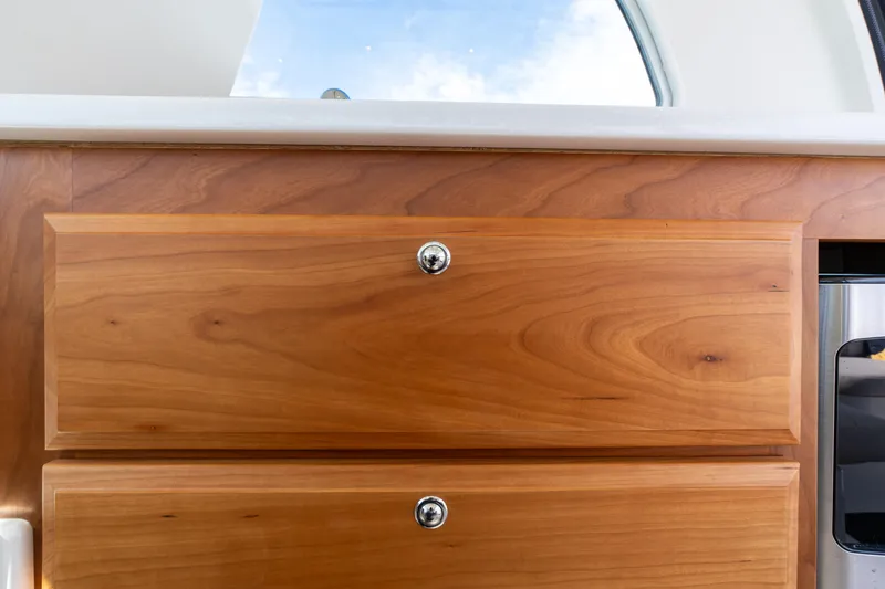 Slide: The Image of Wooden cabinetry detail on 2023 Back Cove 340 boat interior. - 33