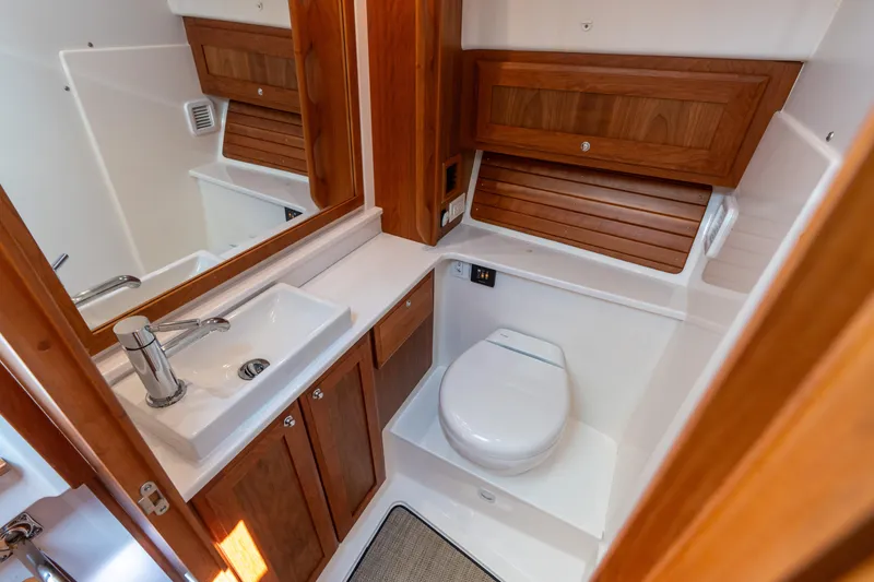 Slide: The Image of Luxurious 2023 Back Cove 340 yacht bathroom with wooden cabinetry and modern fixtures. - 45