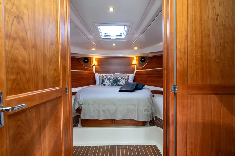 Slide: The Image of Luxurious cabin interior of 2023 Back Cove 340 yacht with cozy bed and wooden finish. - 50