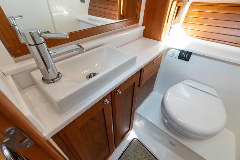 Slide: The Image of Modern bathroom in 2023 Back Cove 340 yacht with sink and toilet. - 59
