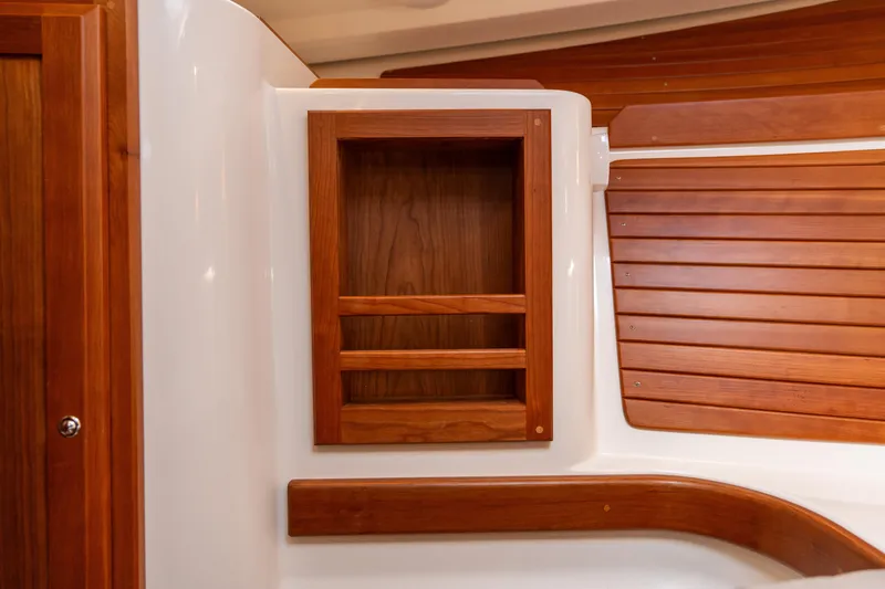 Slide: The Image of 2023 Back Cove 340 interior with wooden cabinetry and paneling. - 62